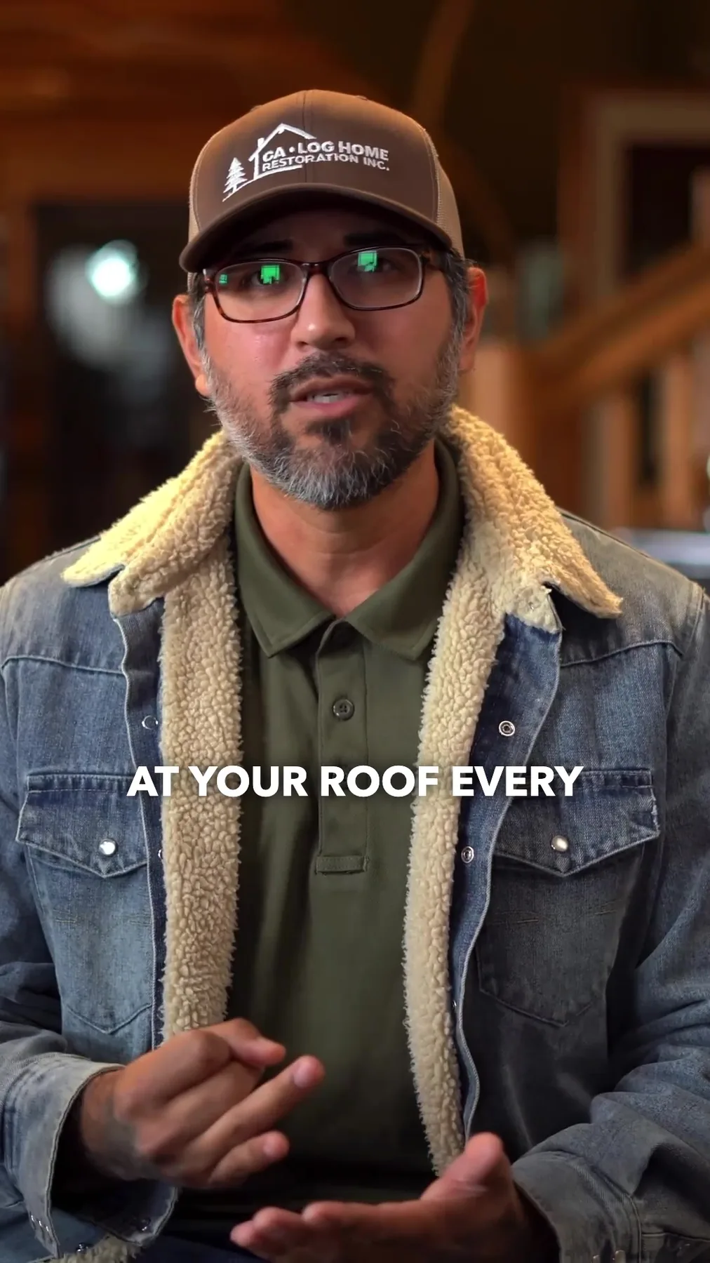 A CALHR representative speaking on camera, wearing a CA Log Home Restoration cap